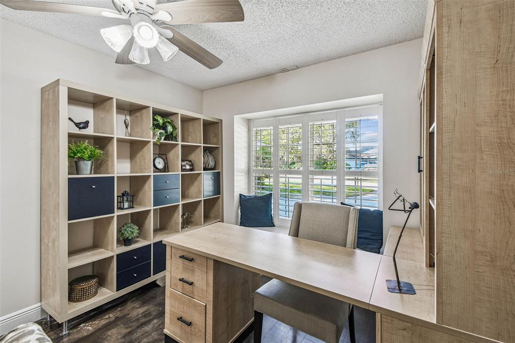 4161 Rolling Springs Drive Tampa, FL 33624 - Photo 45 of 52 a view of a workspace with furniture and a window