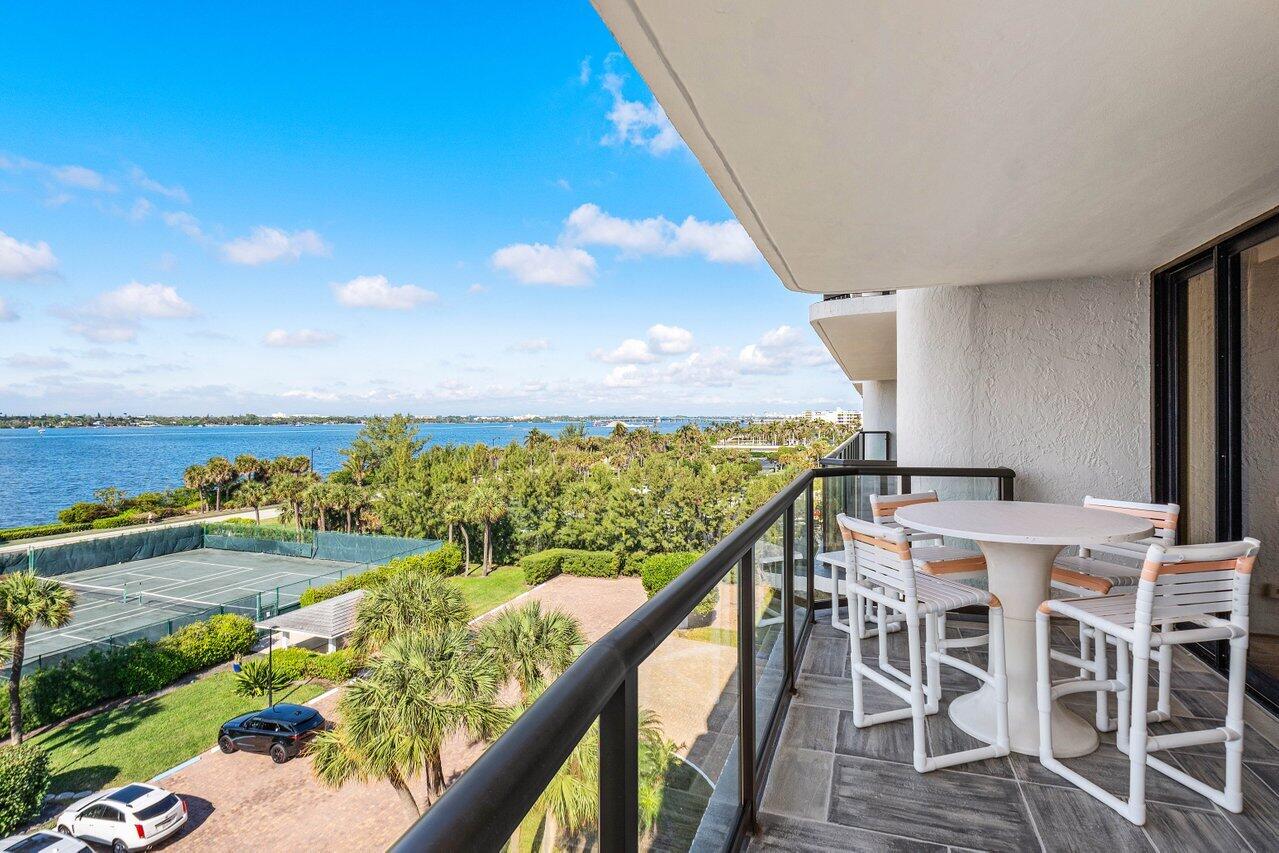3440 South Ocean Boulevard, Unit 508N Palm Beach, FL 33480 - Photo 25 of 34 a view of a chairs and table in wooden floor