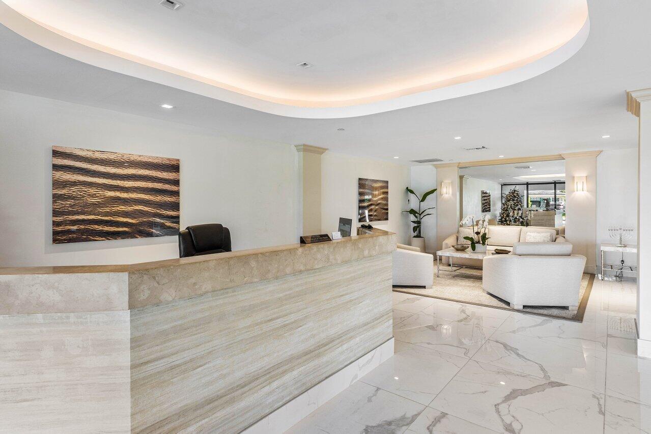 3440 South Ocean Boulevard, Unit 508N Palm Beach, FL 33480 - Photo 28 of 34 a living room with furniture and a flat screen tv