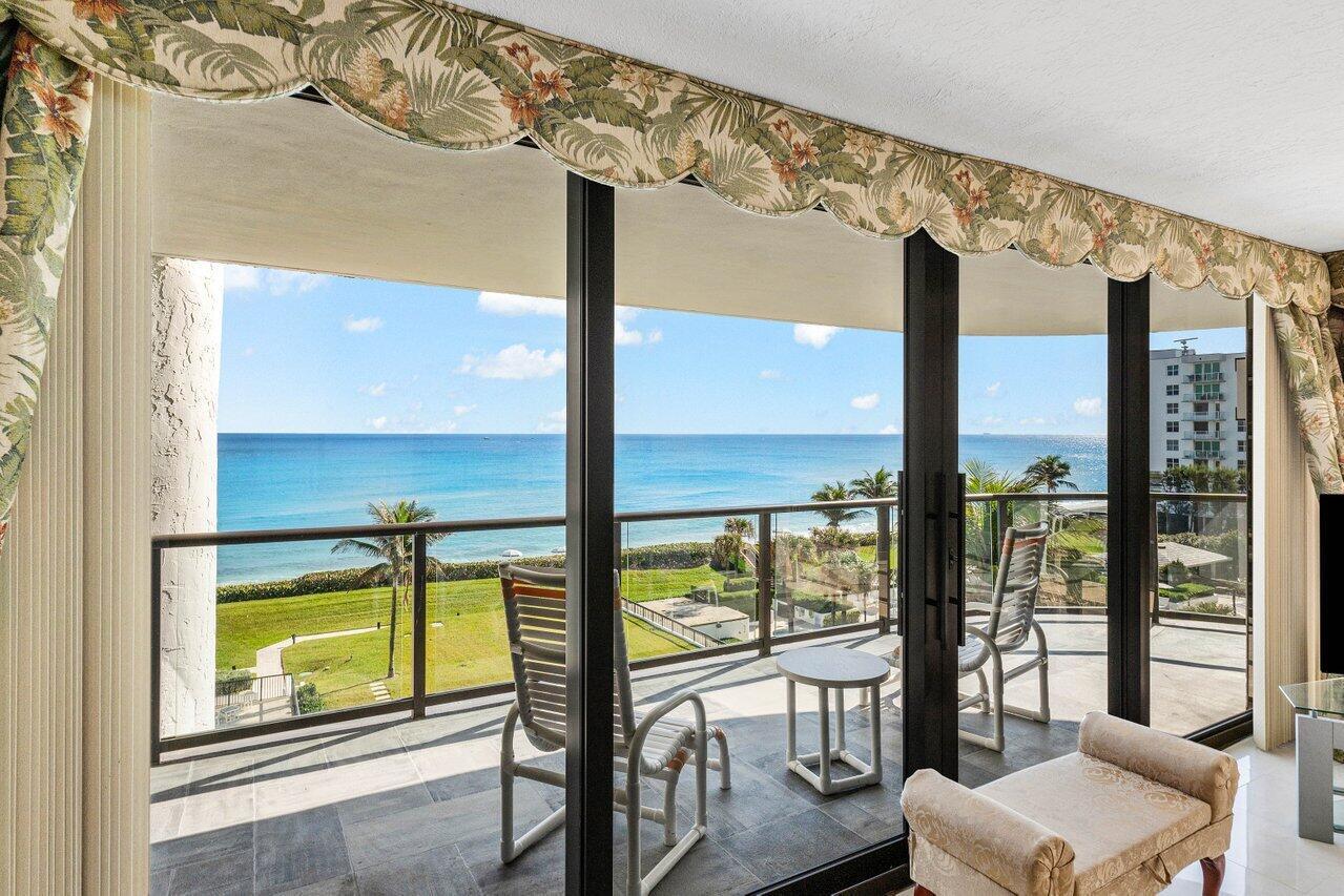 3440 South Ocean Boulevard, Unit 508N Palm Beach, FL 33480 - Photo 7 of 34 a view of an empty room with large windows