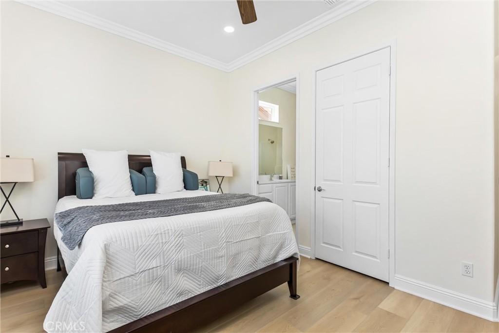 5233 Hampton Road Banning, CA 92220 - Photo 21 of 46 a bedroom with a bed and mirror