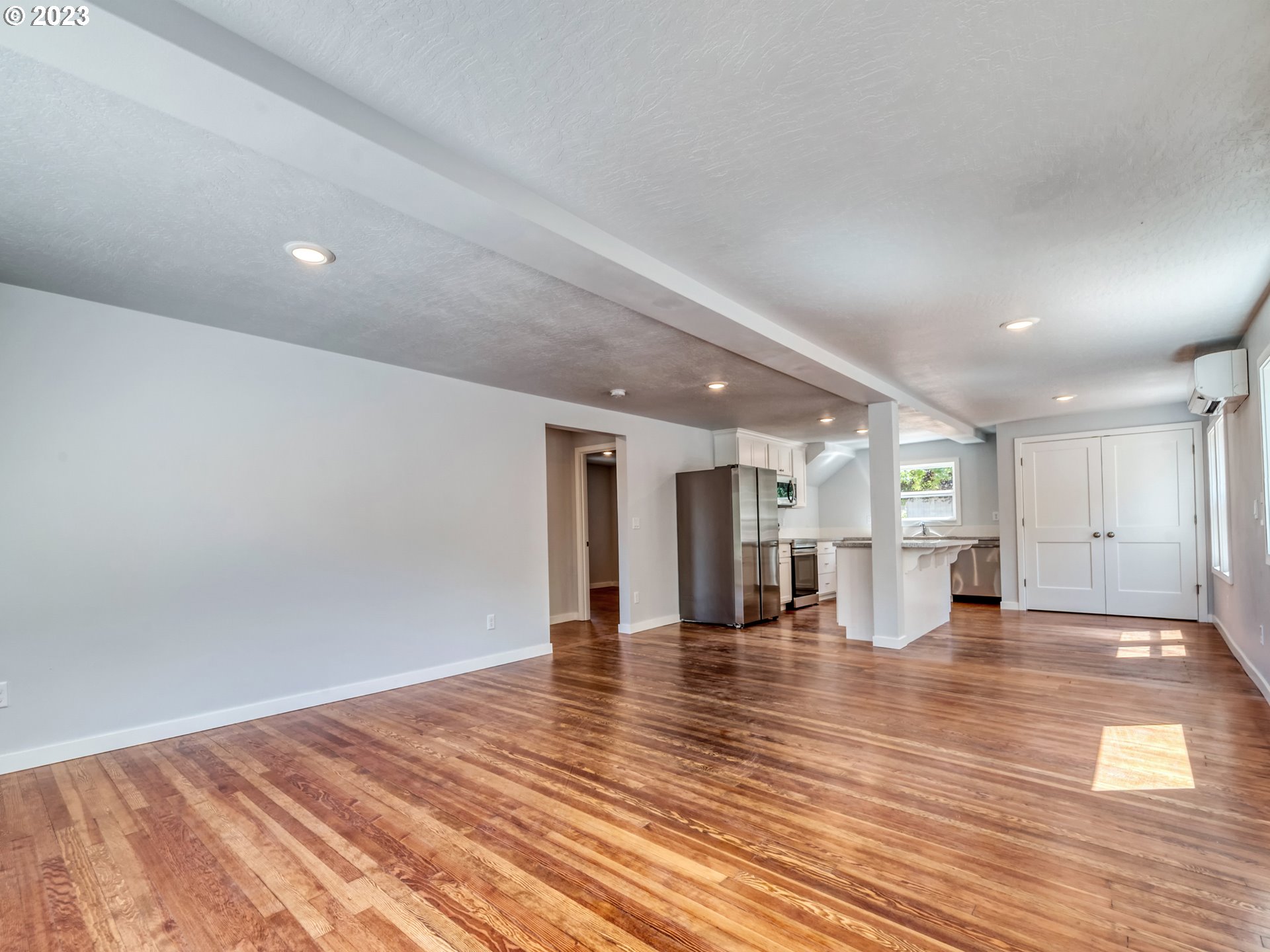 2285 City View Street Eugene, OR 97405 - Photo 12 of 47 a view of empty room with wooden floor