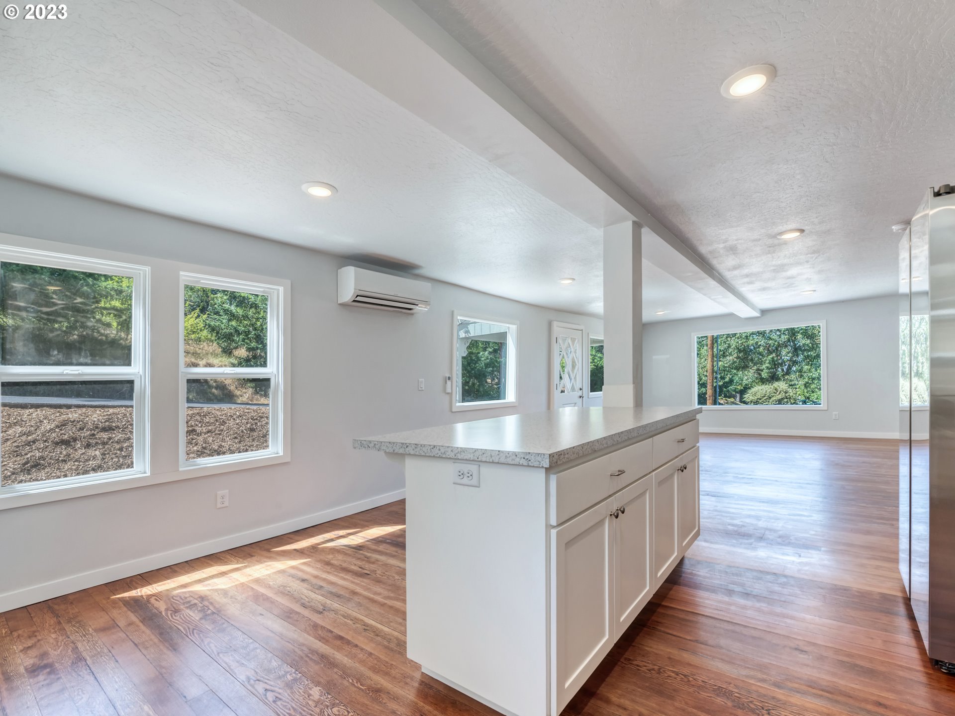 2285 City View Street Eugene, OR 97405 - Photo 13 of 47 a view of kitchen with kitchen island wooden floor and window