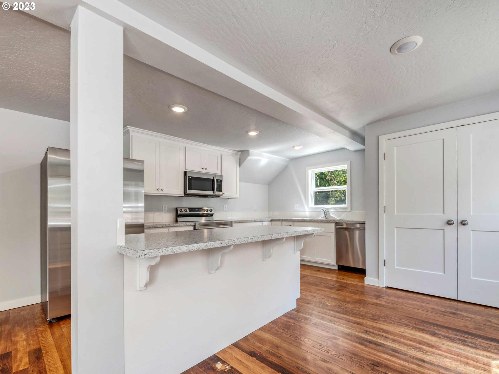 2285 City View Street Eugene, OR 97405 - Photo 14 of 47 a kitchen with stainless steel appliances granite countertop a sink and cabinets