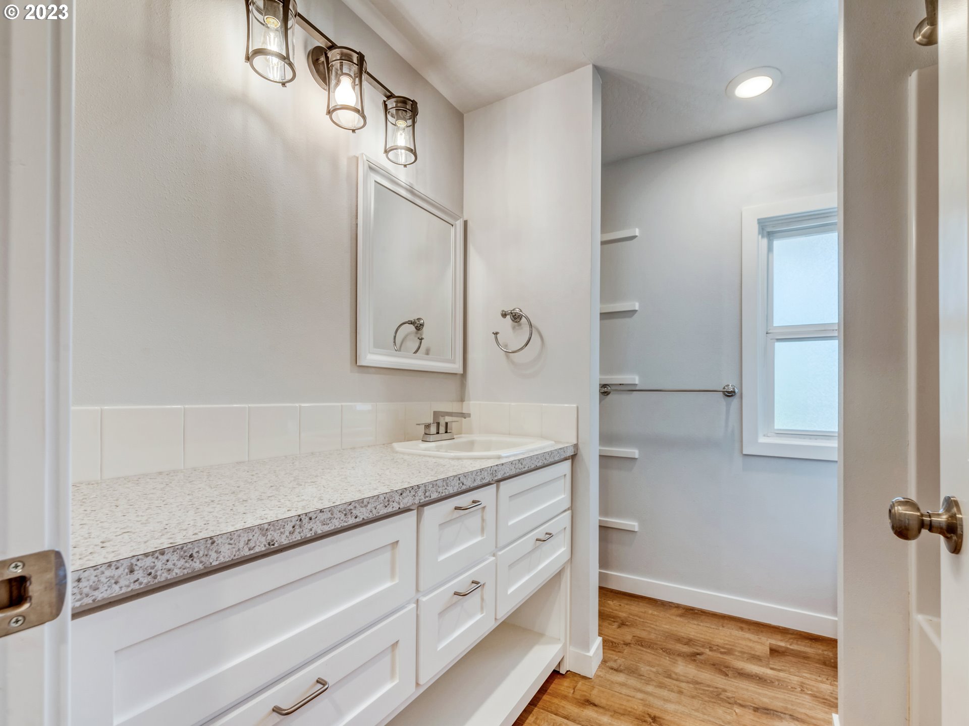 2285 City View Street Eugene, OR 97405 - Photo 20 of 47 a bathroom with a granite countertop sink and a mirror