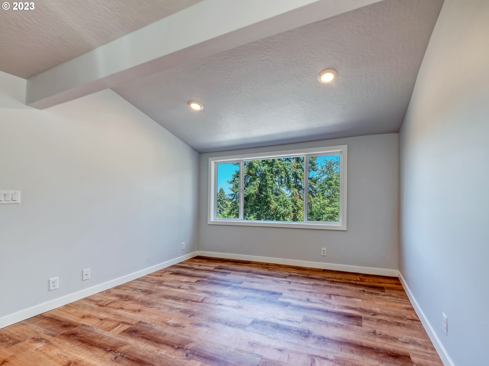 2285 City View Street Eugene, OR 97405 - Photo 26 of 47 an empty room with wooden floor and windows