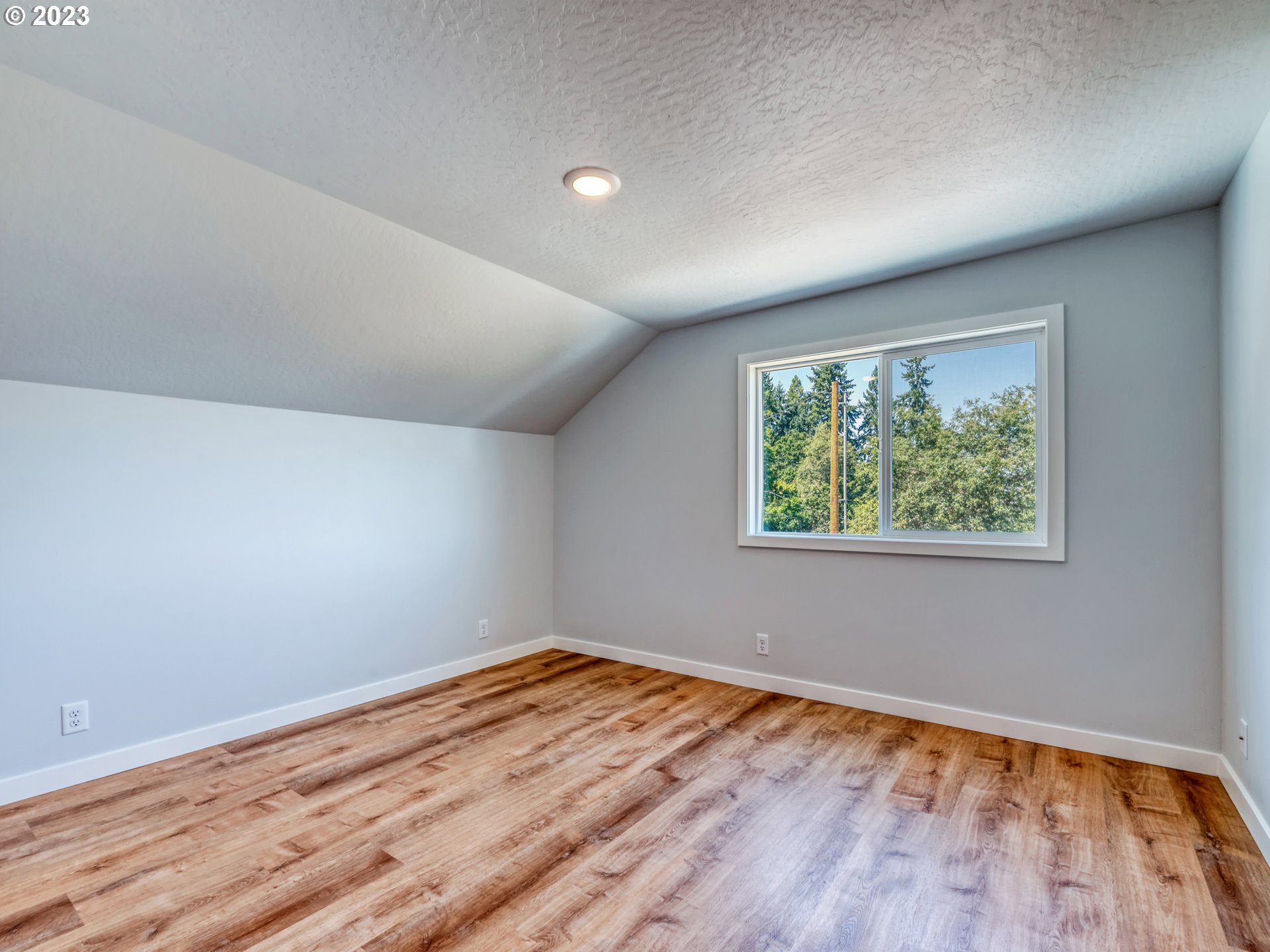 2285 City View Street Eugene, OR 97405 - Photo 35 of 47 a view of empty room with wooden floor and fan