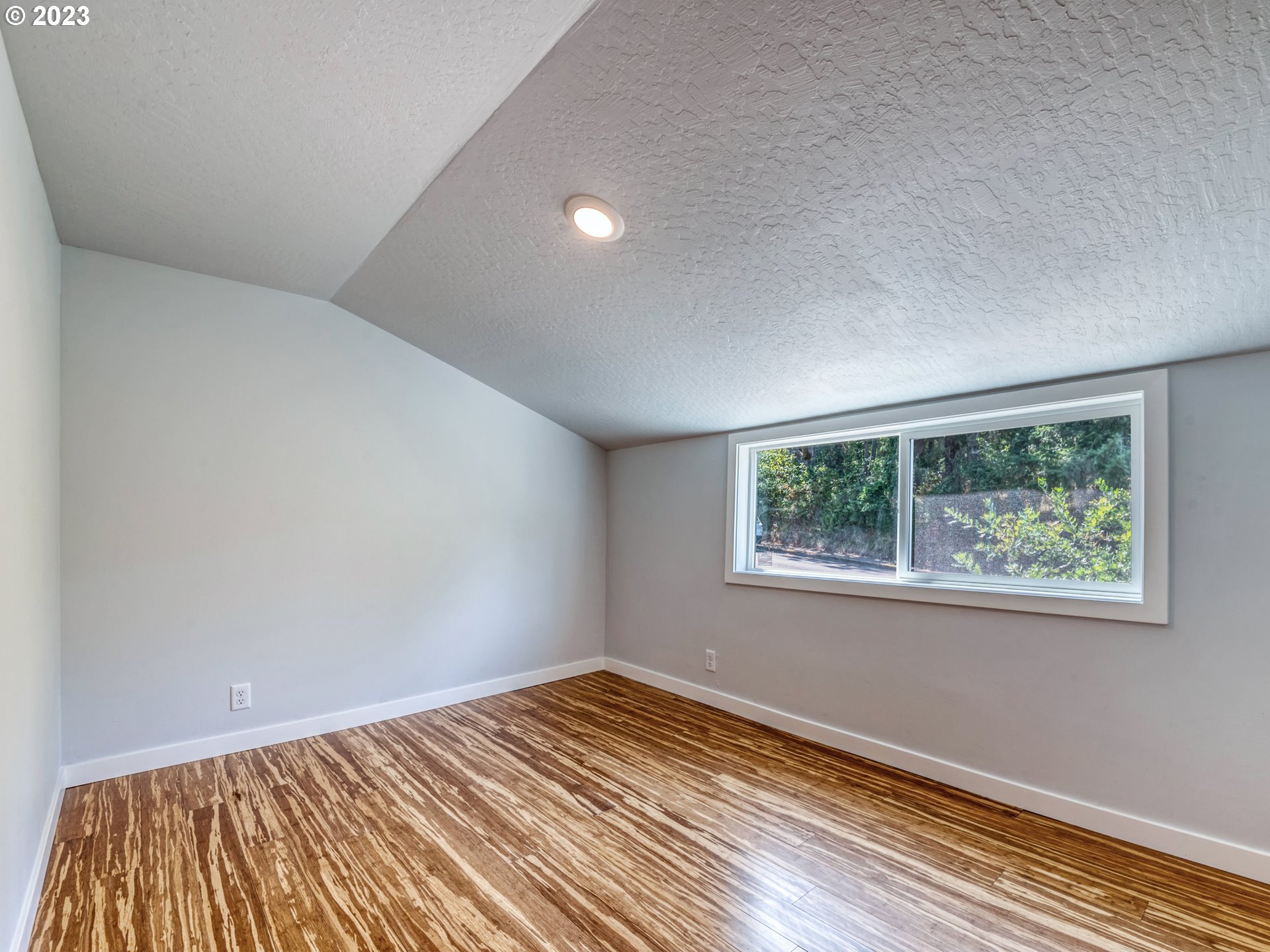 2285 City View Street Eugene, OR 97405 - Photo 38 of 47 a view of a room with wooden floor and window