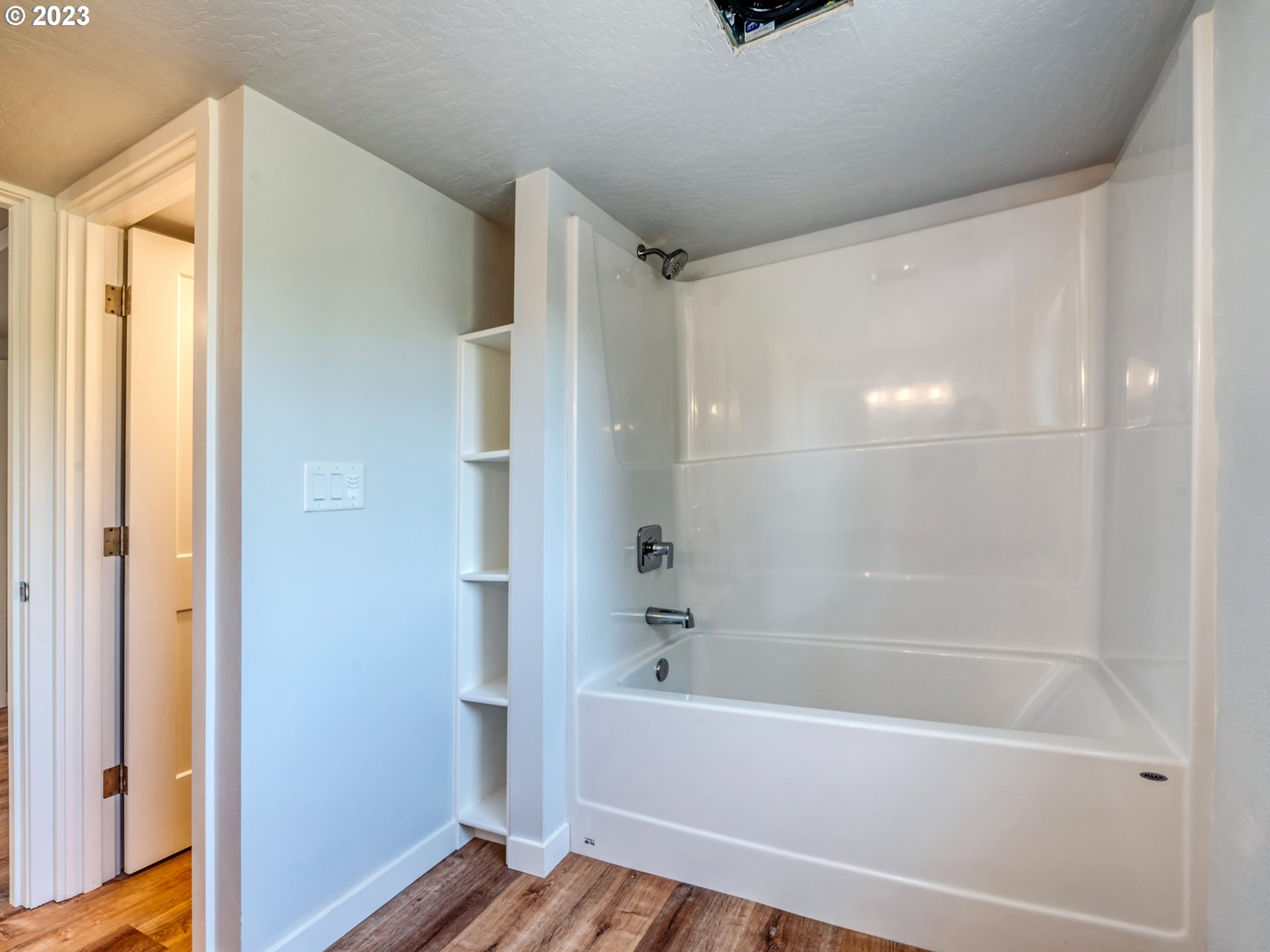 2285 City View Street Eugene, OR 97405 - Photo 41 of 47 a bathroom with a bathtub and a shower