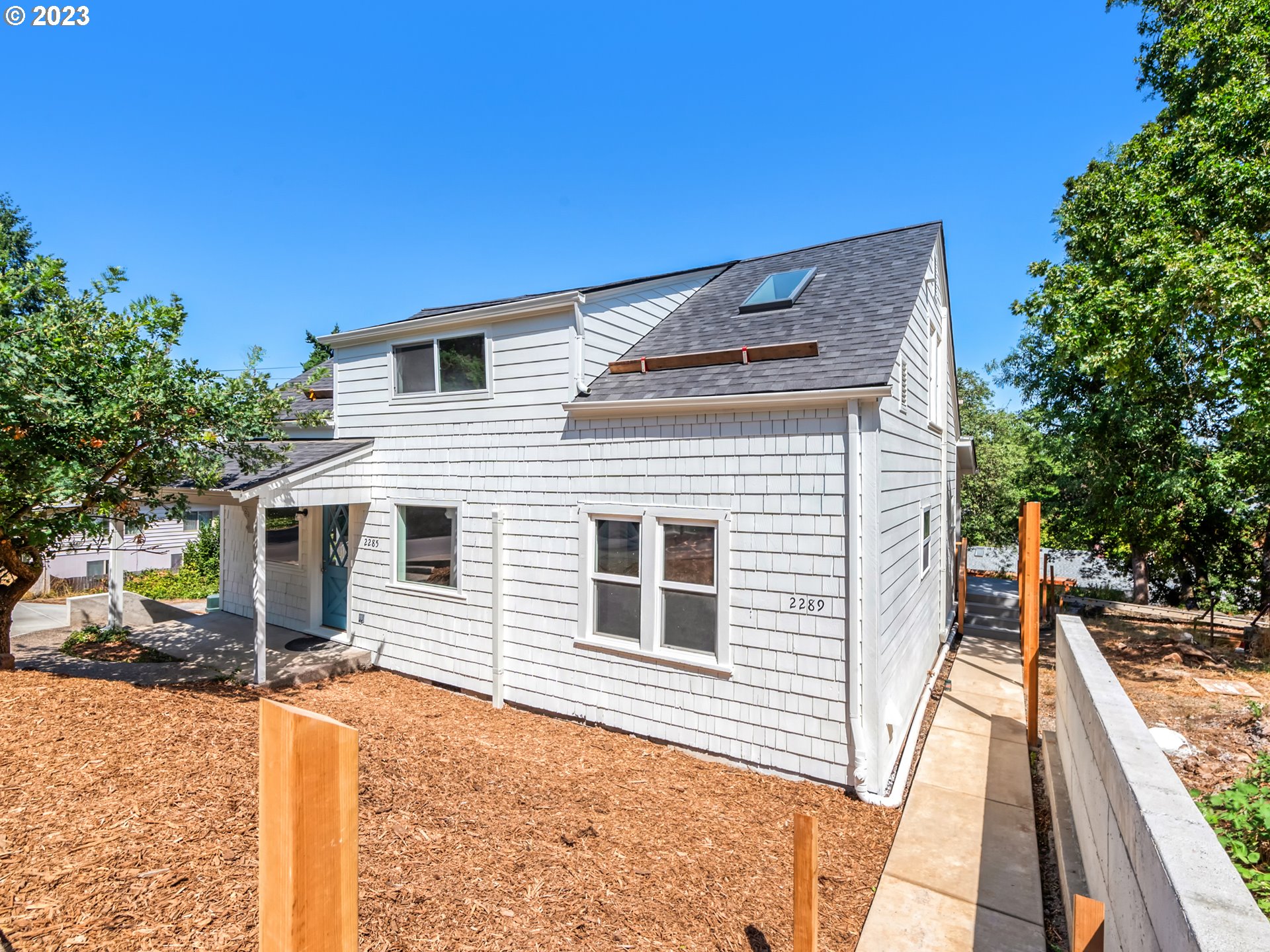 2285 City View Street Eugene, OR 97405 - Photo 7 of 47 a front view of a house with a yard