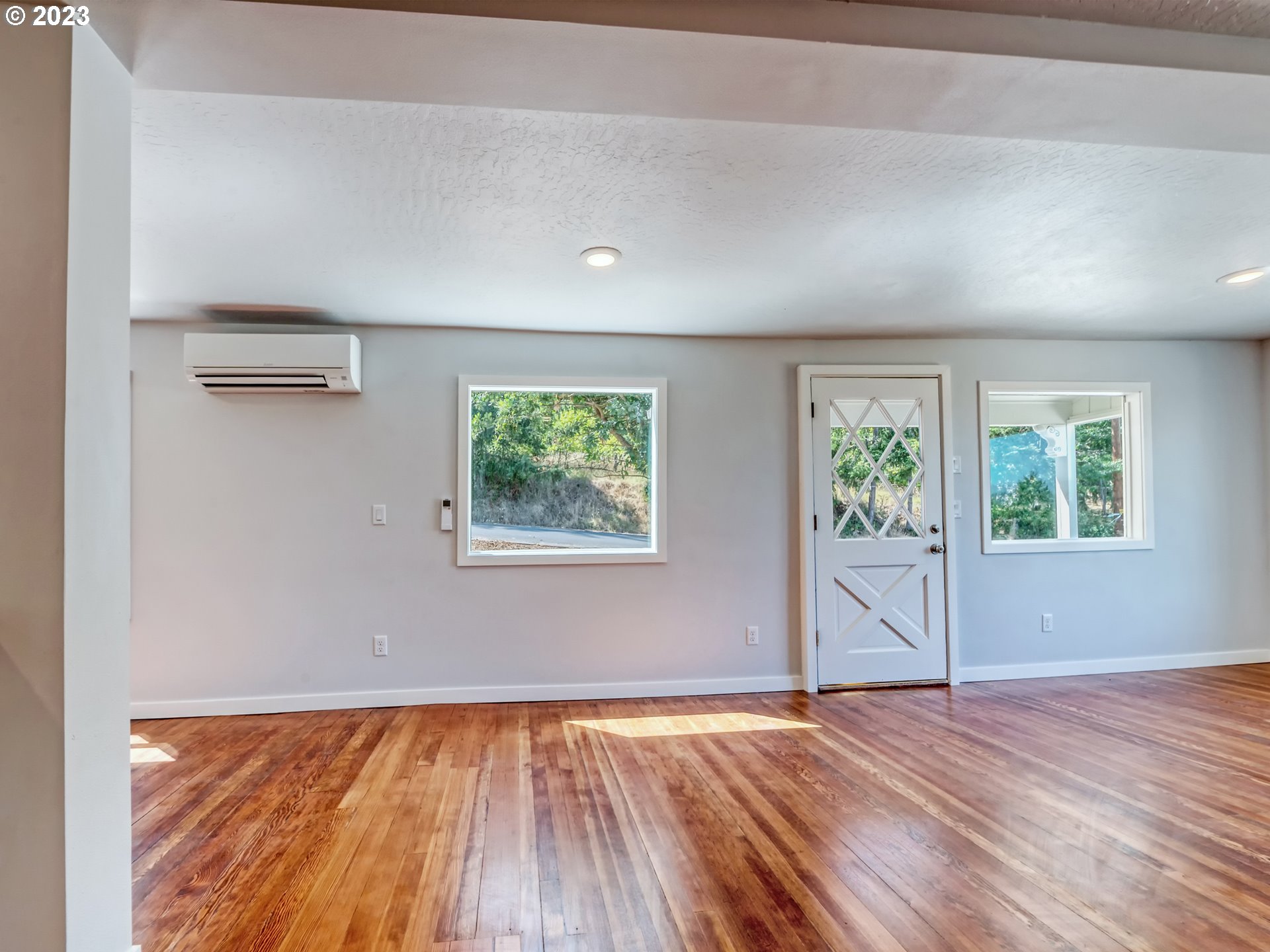 2285 City View Street Eugene, OR 97405 - Photo 8 of 47 an empty room with wooden floor and window