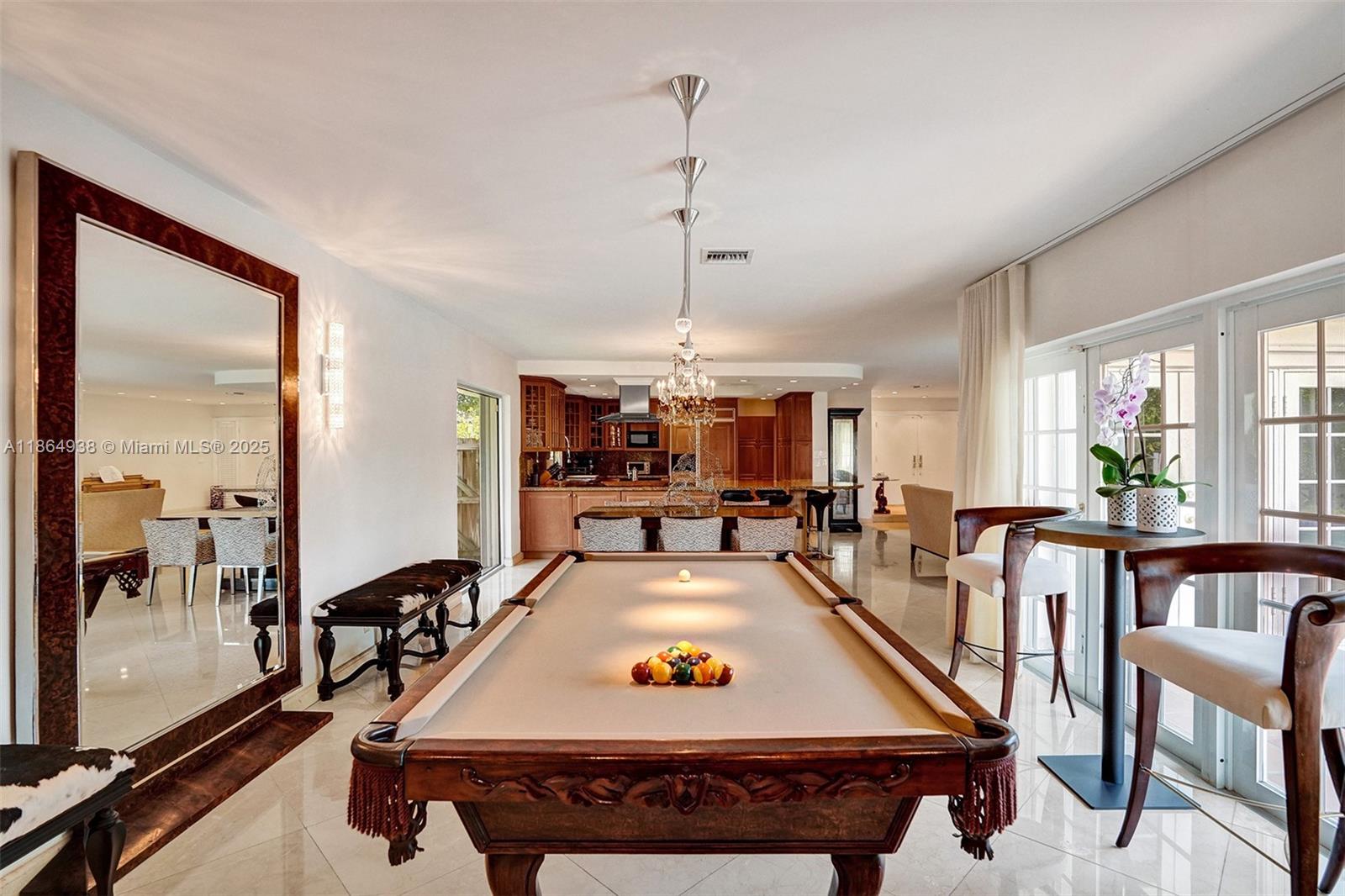 12840 Hickory Road North Miami, FL 33181 - Photo 11 of 21 a living room with furniture a pool table and a chandelier