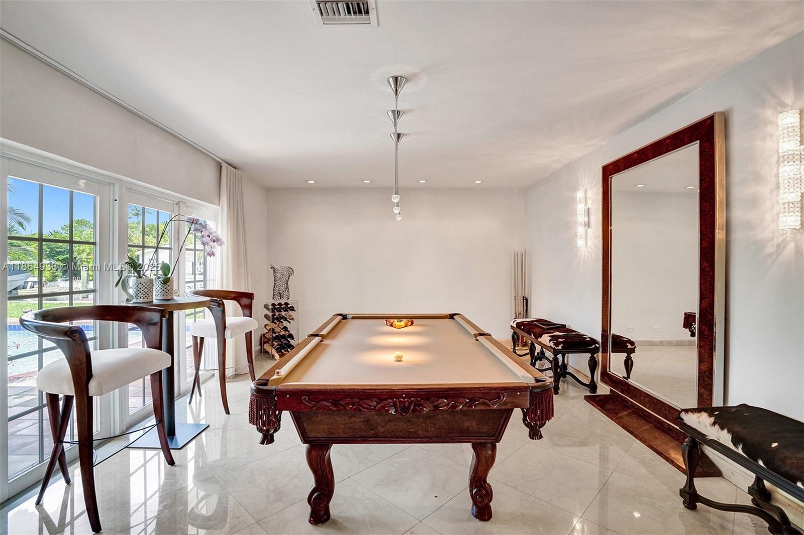 12840 Hickory Road North Miami, FL 33181 - Photo 12 of 21 a view of a dining room with furniture