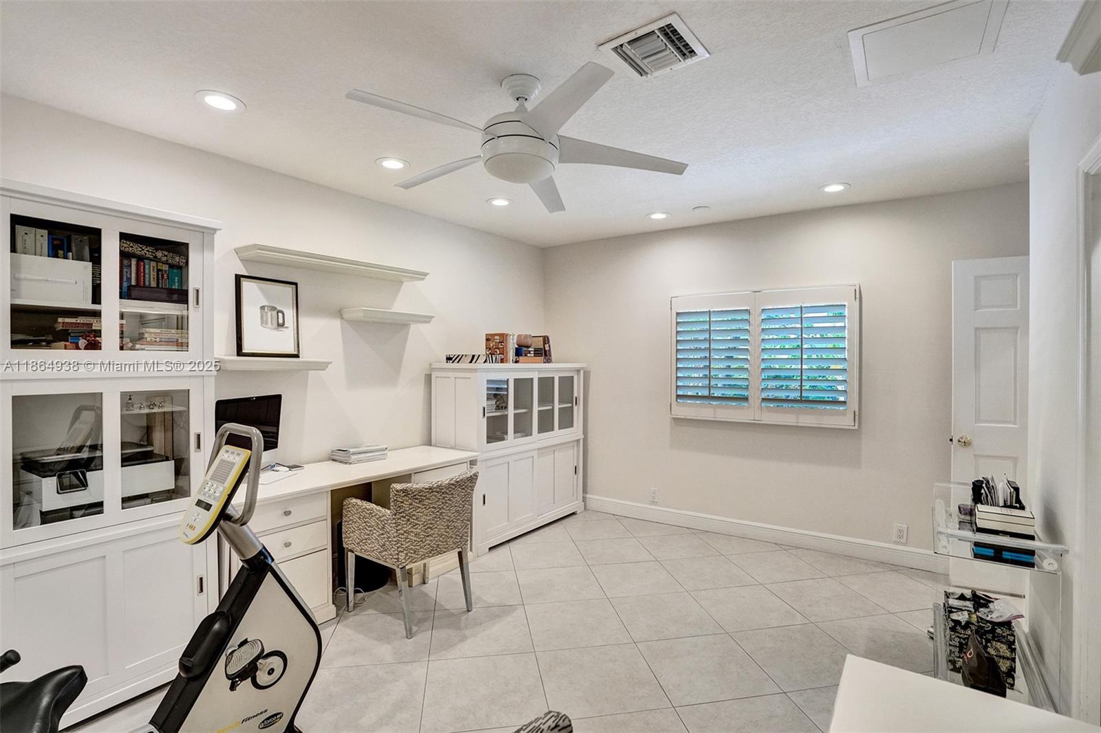 12840 Hickory Road North Miami, FL 33181 - Photo 20 of 21 a view of a workspace with furniture and a window