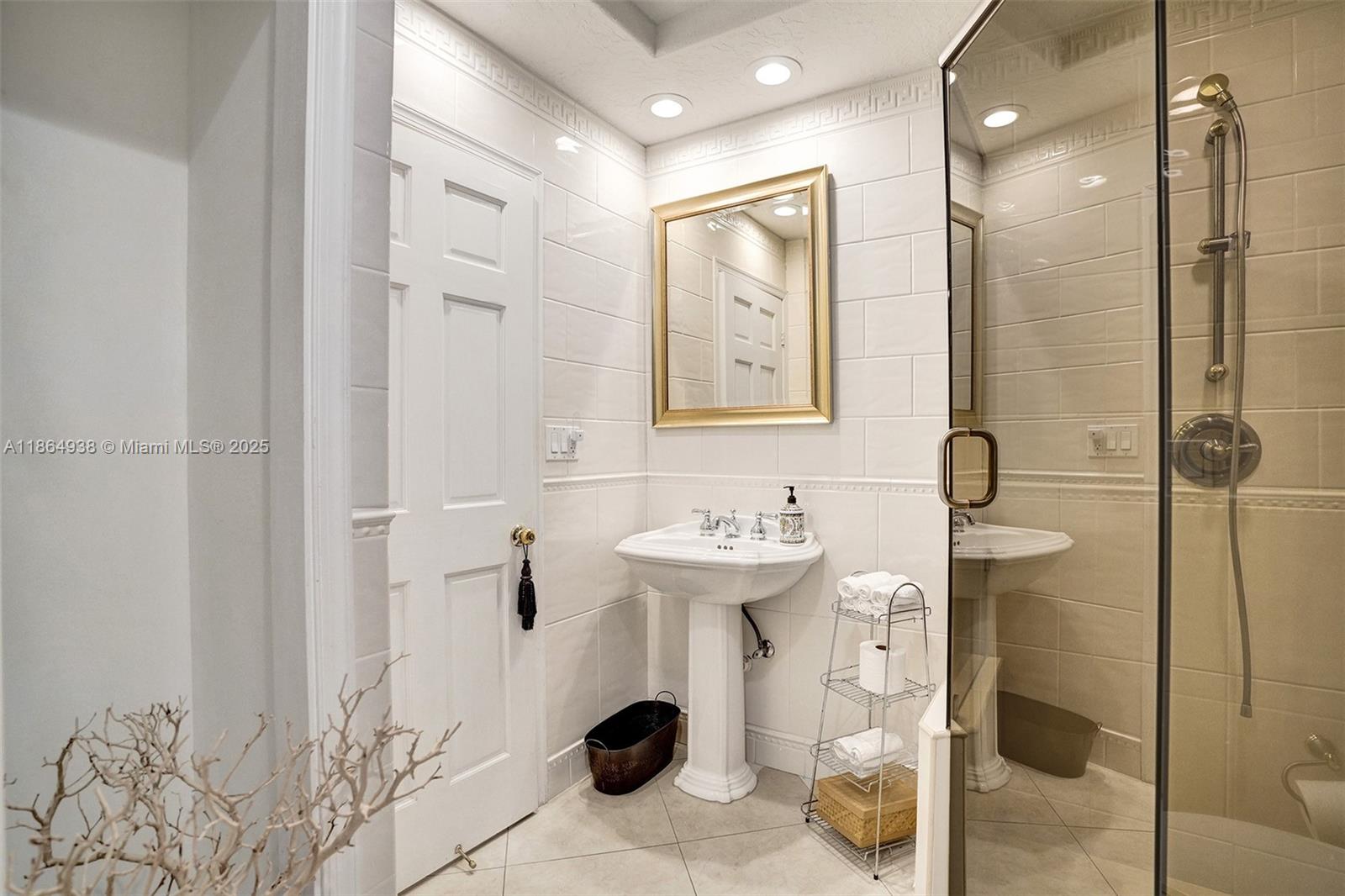 12840 Hickory Road North Miami, FL 33181 - Photo 21 of 21 a bathroom with a sink a toilet and shower