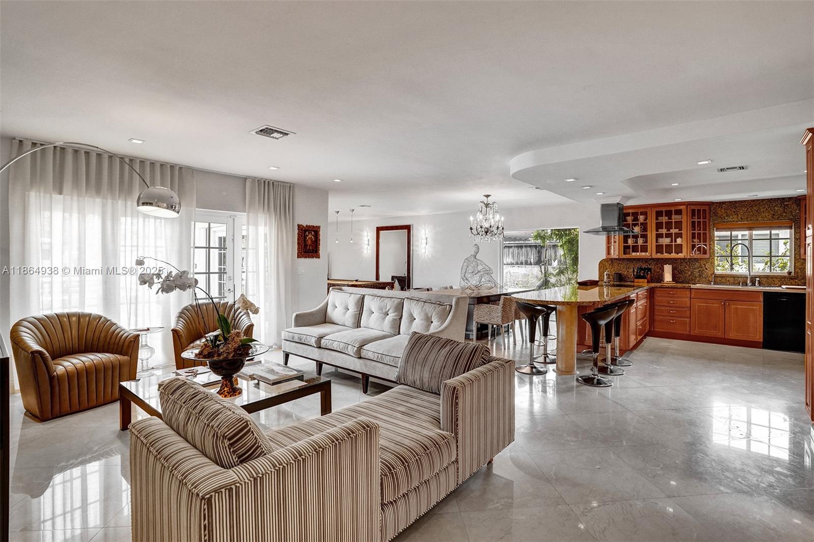 12840 Hickory Road North Miami, FL 33181 - Photo 8 of 21 a living room with furniture and a large window