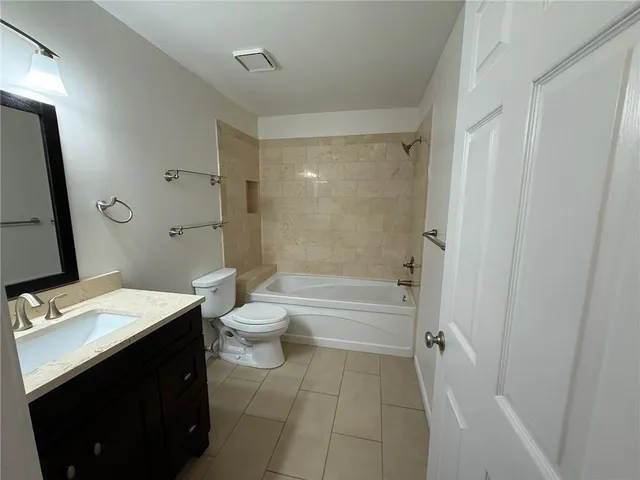 a view of a house with backyard and porch