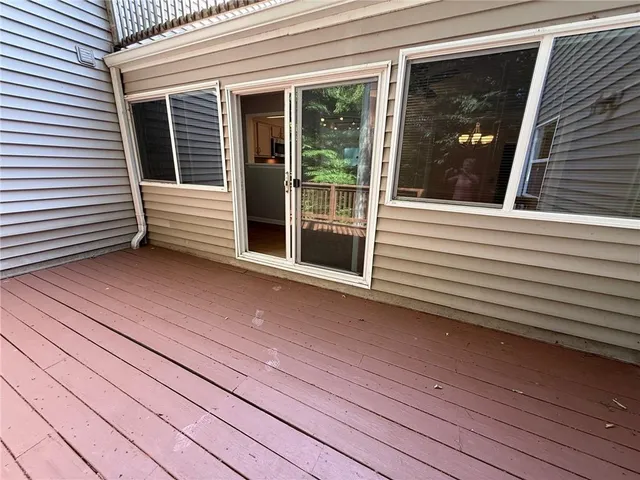 a view of a balcony with wooden floor