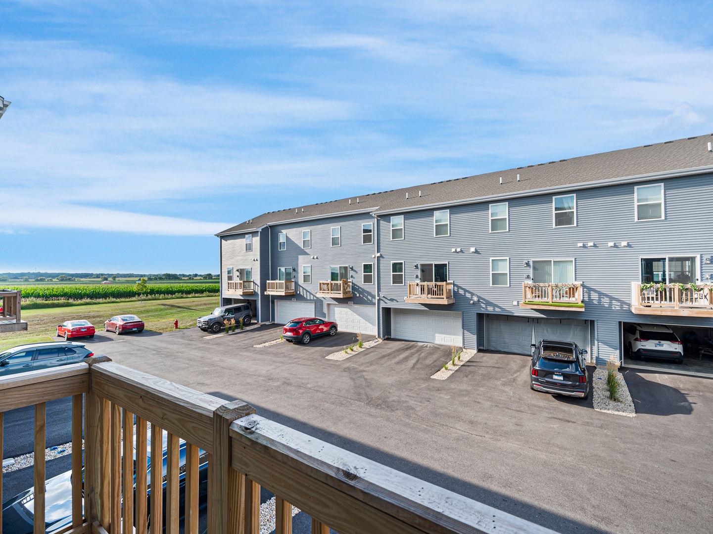 1533 Yosemite Way Pingree Grove, IL 60140 - Photo 16 of 17 a view of a patio with dining table and chairs with wooden floor and fence