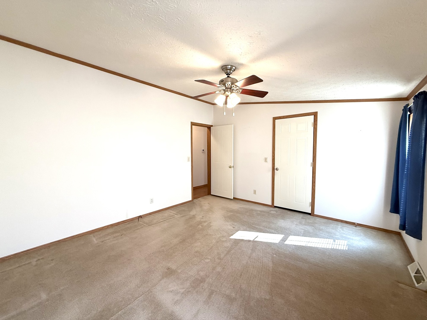 461 Meadowlark Circle, Unit A Sandwich, IL 60548 - Photo 15 of 28 an empty room with a ceiling fan and a window