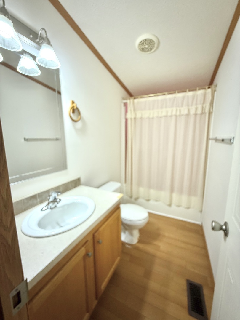 461 Meadowlark Circle, Unit A Sandwich, IL 60548 - Photo 20 of 28 a bathroom with a sink and a mirror