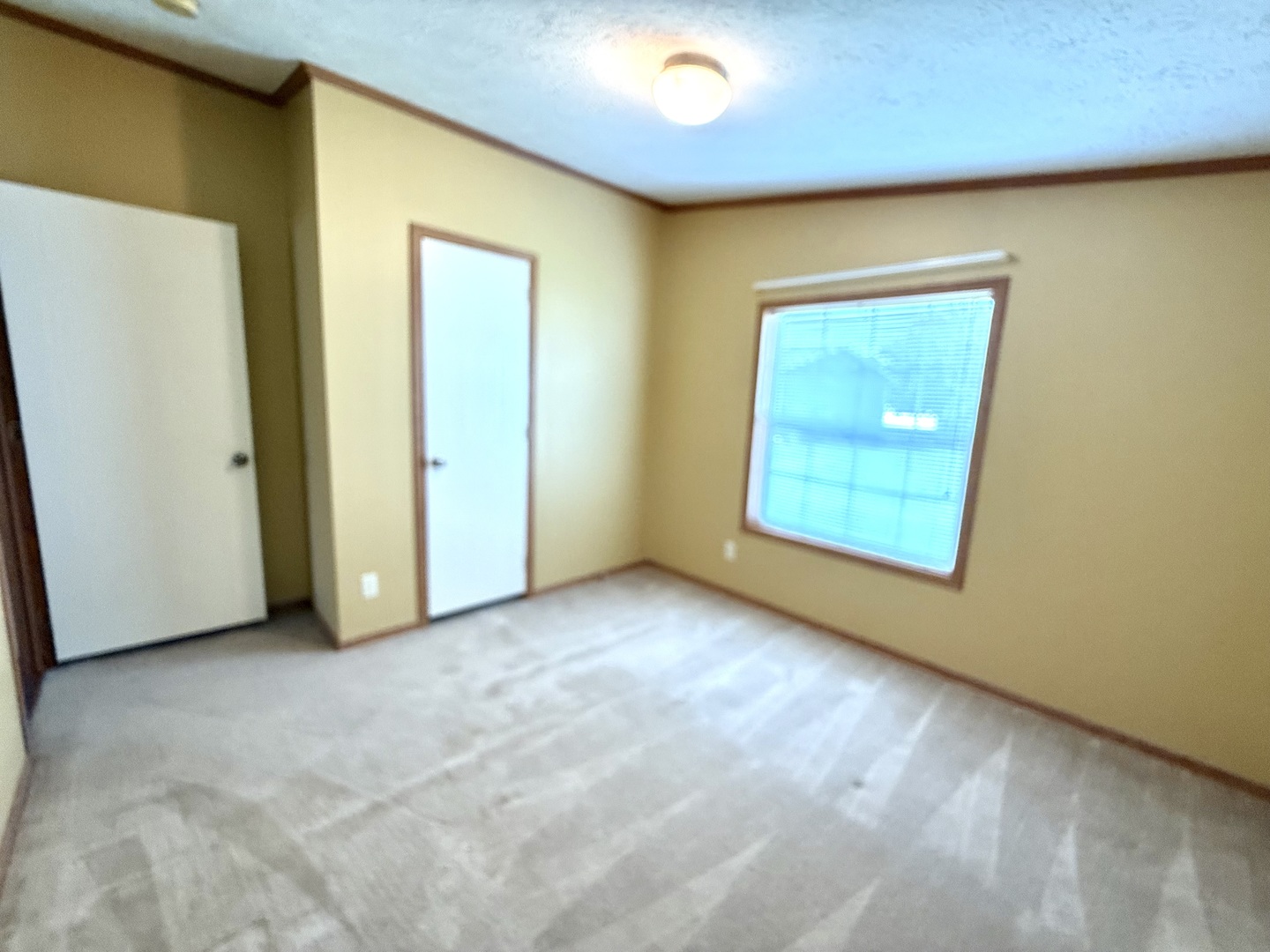 461 Meadowlark Circle, Unit A Sandwich, IL 60548 - Photo 22 of 28 an empty room with windows