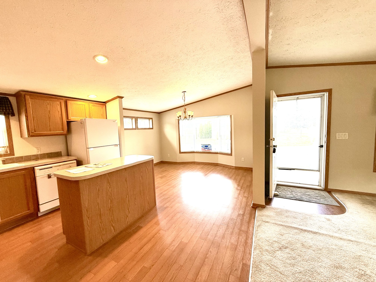 461 Meadowlark Circle, Unit A Sandwich, IL 60548 - Photo 27 of 28 a view of a kitchen with wooden floor and a sink