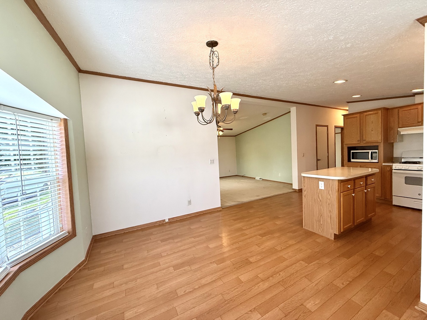 461 Meadowlark Circle, Unit A Sandwich, IL 60548 - Photo 8 of 28 a view of a kitchen with a sink wooden floor and a kitchen