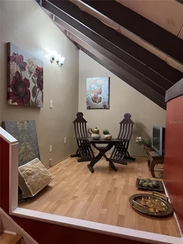 a room with furniture and a wooden floor