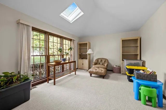 a bedroom with furniture and a window