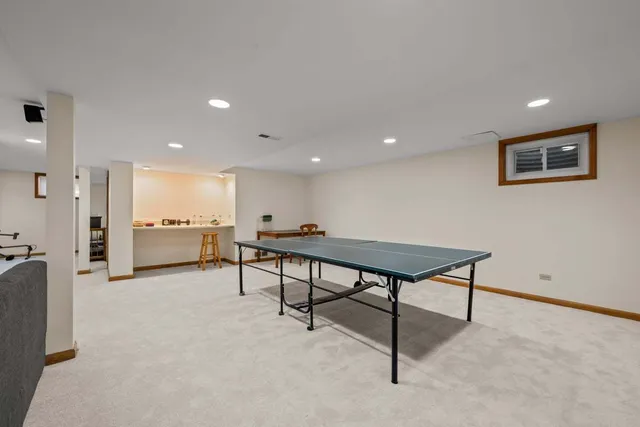 a view of a livingroom with furniture and a potted plant