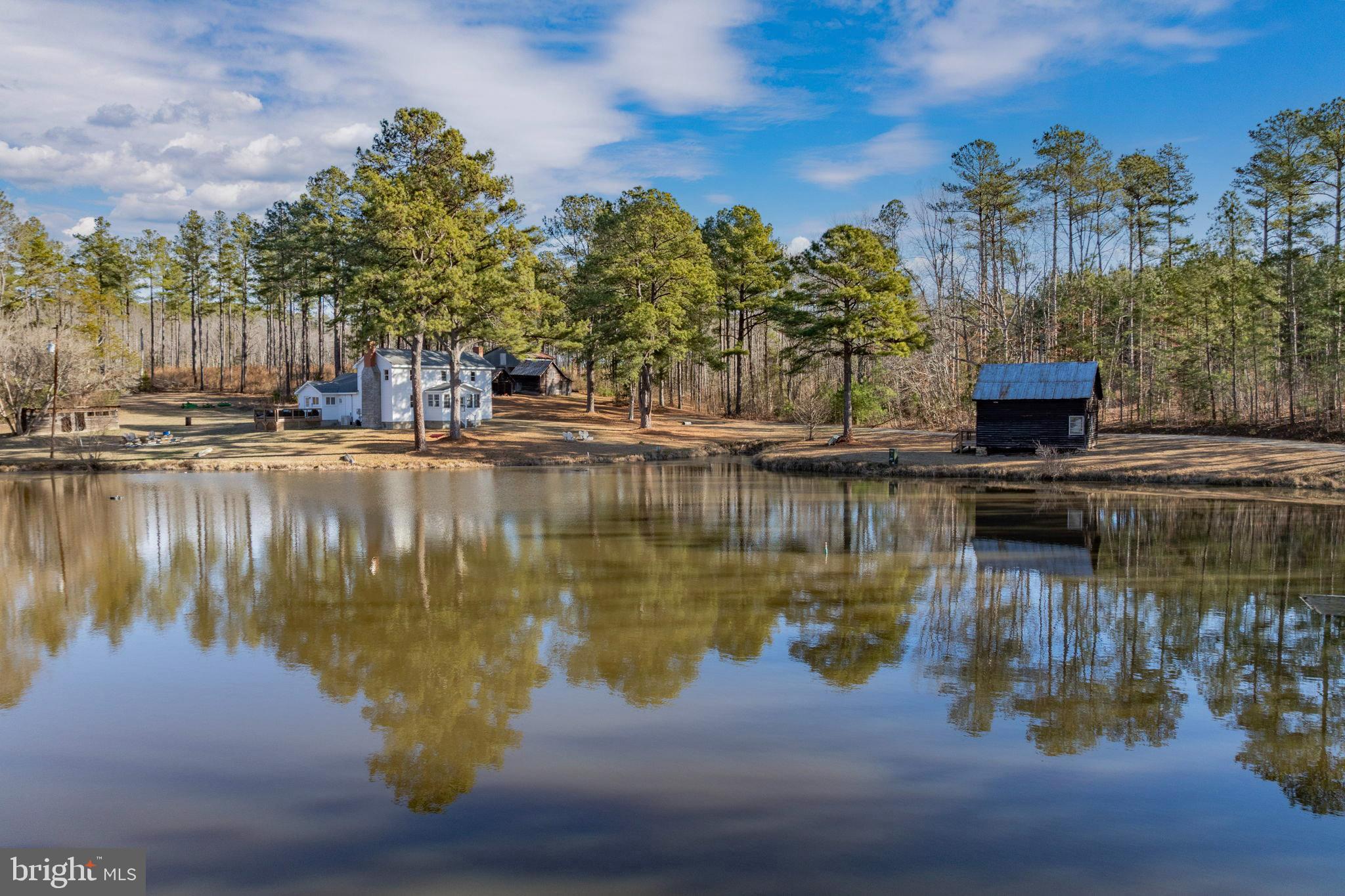 1052 South Hill Road Brodnax, VA 23920 - Photo 1 of 100 a view of a lake with houses