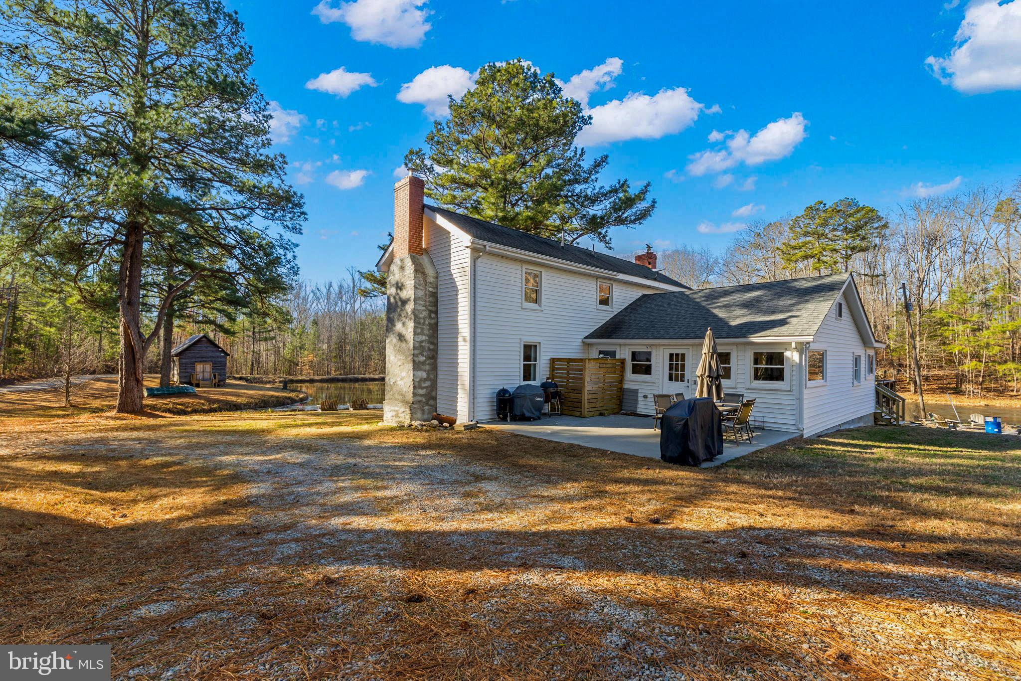 1052 South Hill Road Brodnax, VA 23920 - Photo 11 of 100 a front view of a house with a yard and garage