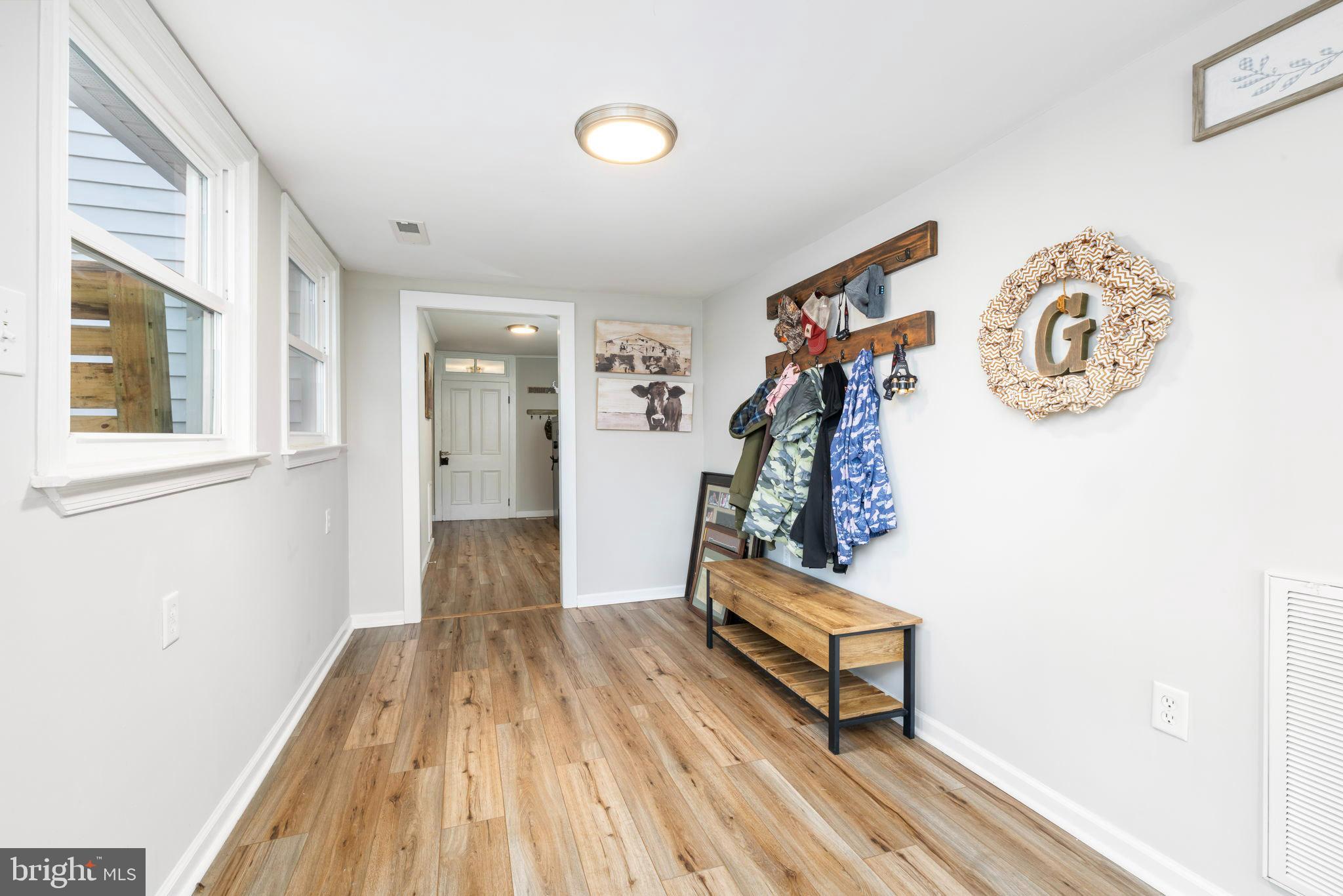 1052 South Hill Road Brodnax, VA 23920 - Photo 19 of 100 a view of a hallway with wooden floor