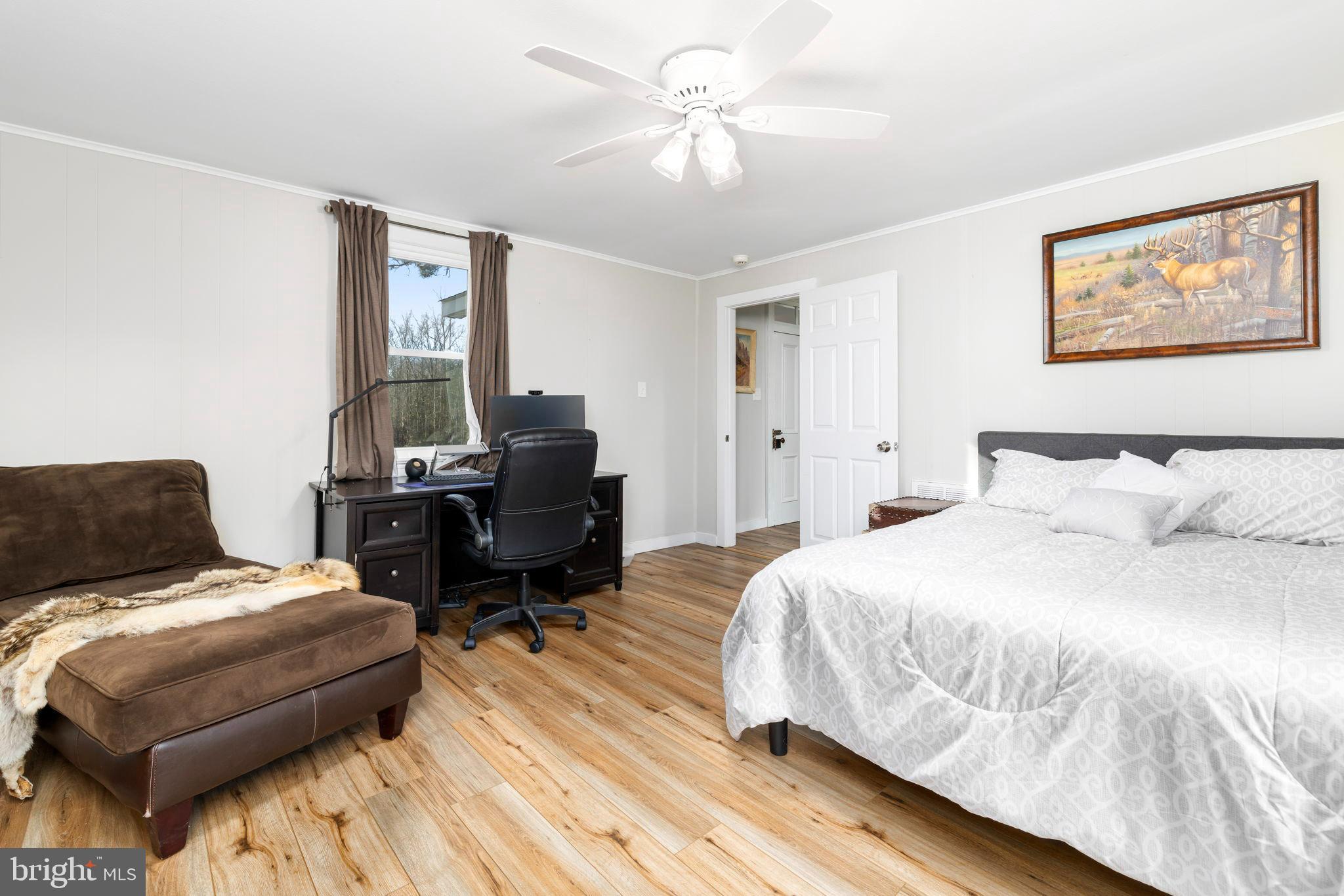 1052 South Hill Road Brodnax, VA 23920 - Photo 22 of 100 a bedroom with a bed and a desk