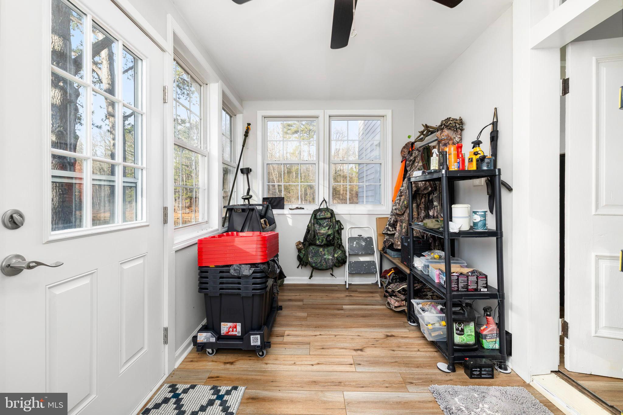 1052 South Hill Road Brodnax, VA 23920 - Photo 23 of 100 a living room with furniture a flat screen tv and a fireplace