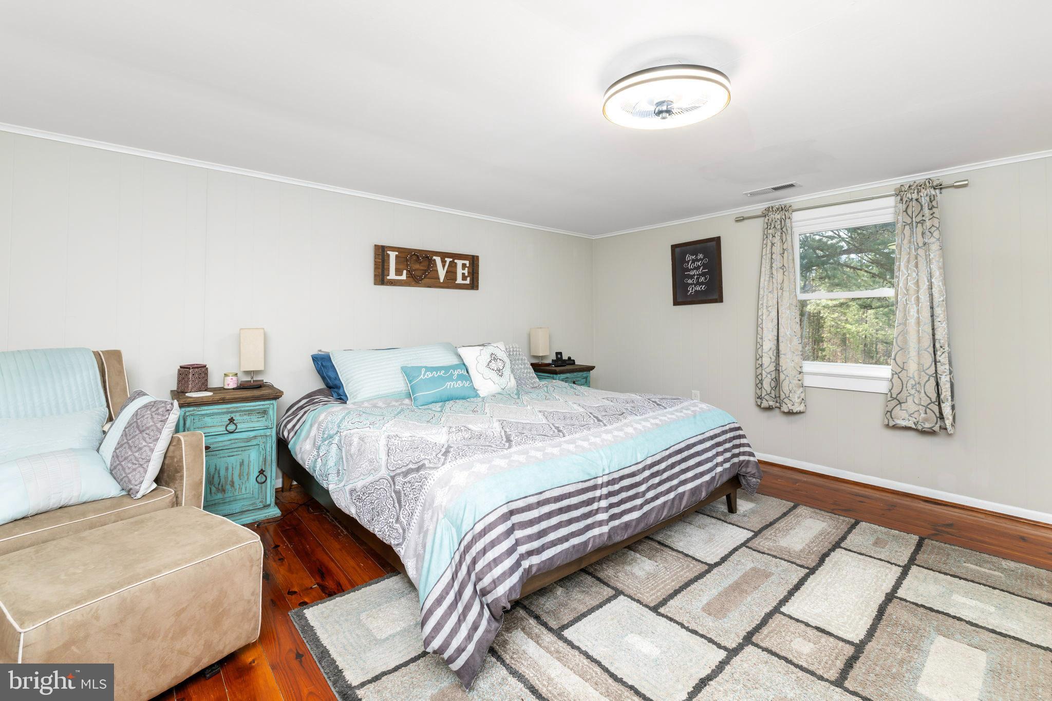 1052 South Hill Road Brodnax, VA 23920 - Photo 34 of 100 a bedroom with a bed and a window