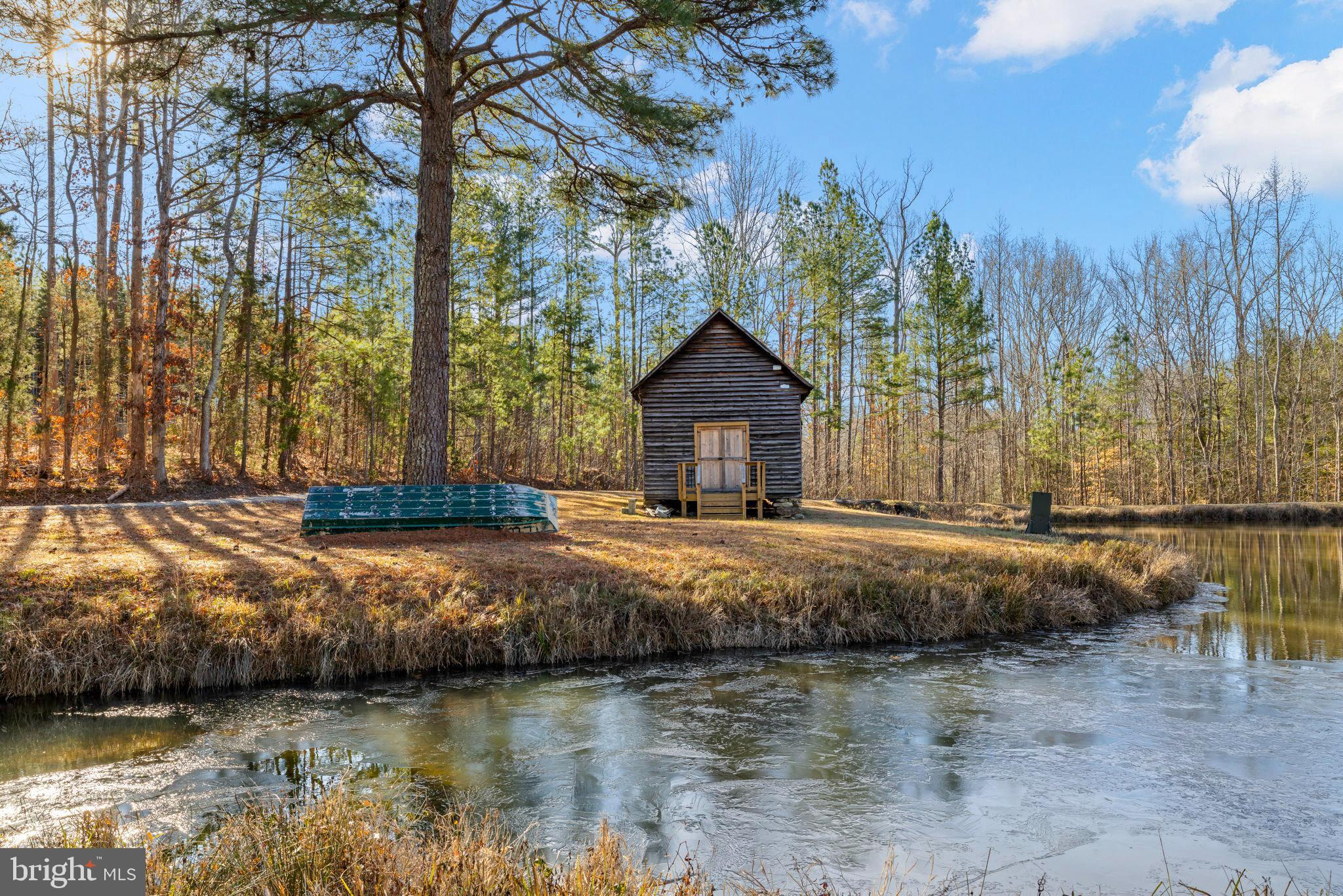 1052 South Hill Road Brodnax, VA 23920 - Photo 44 of 100 a backyard of a house with lots of green space