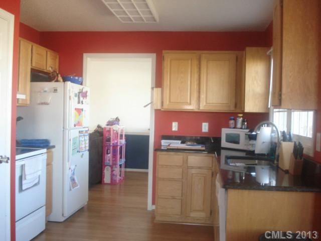 2080 Crescent Road Salisbury, NC 28146 - Photo 11 of 13 a kitchen with stainless steel appliances granite countertop a refrigerator and a stove