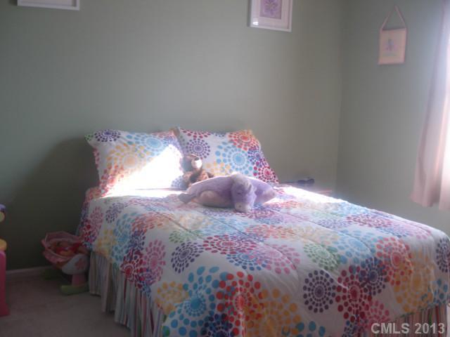 2080 Crescent Road Salisbury, NC 28146 - Photo 4 of 13 a bed sitting in a bedroom next to a window