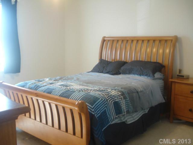 2080 Crescent Road Salisbury, NC 28146 - Photo 5 of 13 a bed sitting in a bedroom next to a window