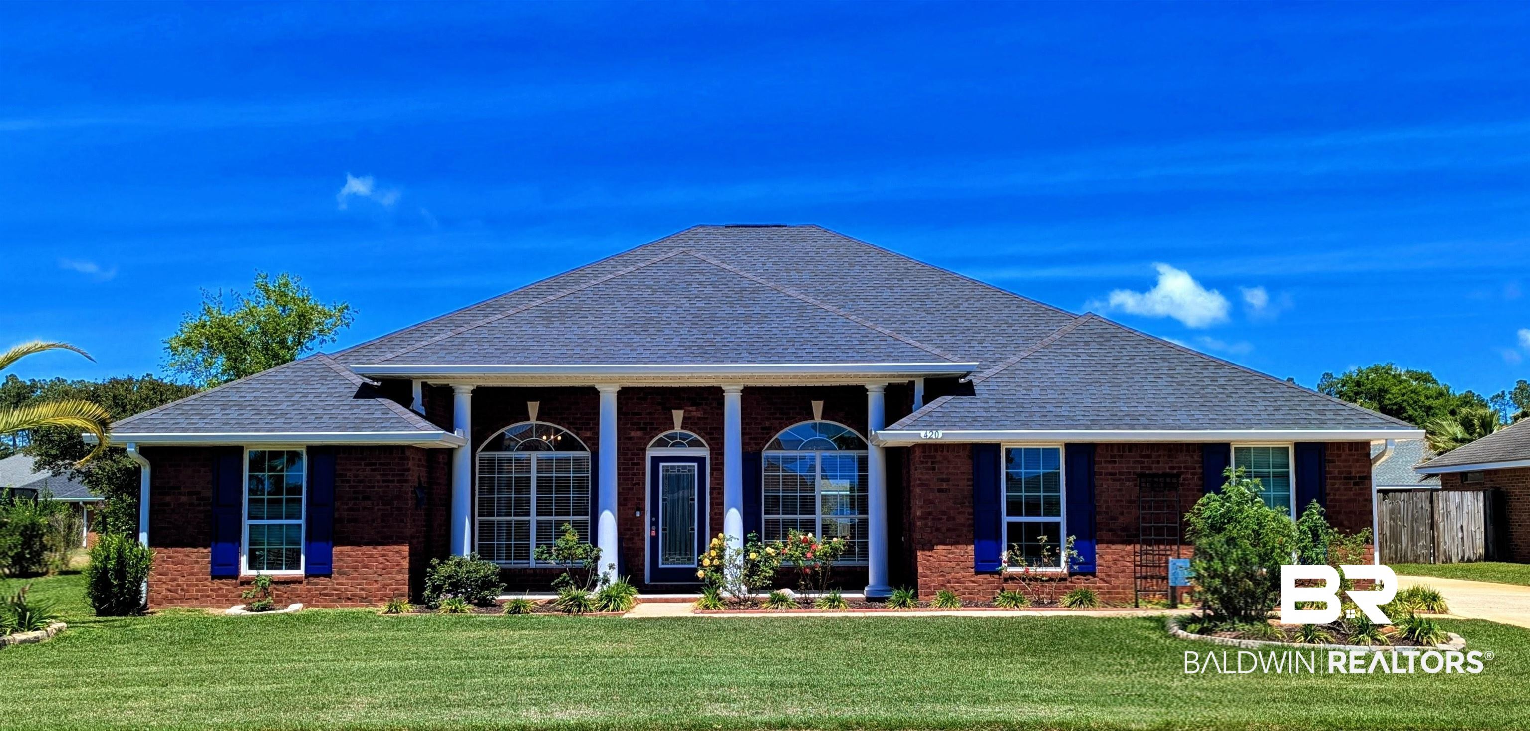 420 Collinwood Loop Foley, AL 36535 - Photo 11 of 74 Neoclassical home featuring covered porch, a front lawn, roof with shingles, and brick siding