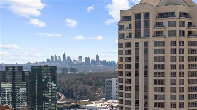 3475 Oak Valley Road Northeast, Unit 410 Atlanta, GA 30326 - Photo 1 of 36 a view of a building with a city street