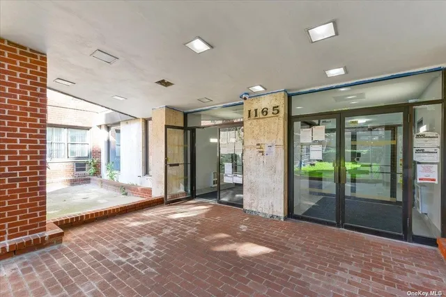 a view of a big room with windows