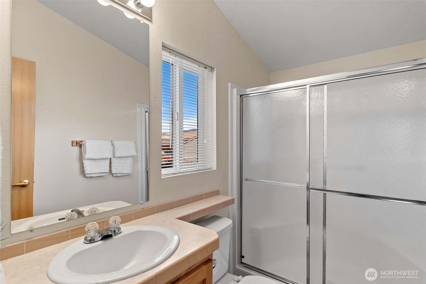 1232 Woods Street Wenatchee, WA 98801 - Photo 26 of 31 a bathroom with a sink and a mirror