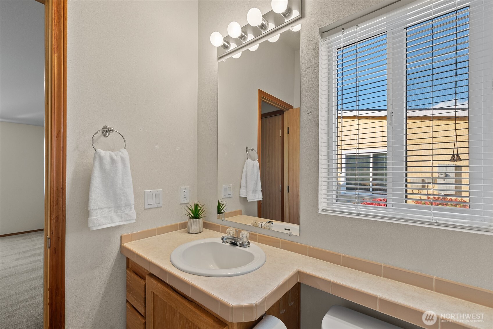 1232 Woods Street Wenatchee, WA 98801 - Photo 27 of 31 a bathroom with a sink and a mirror