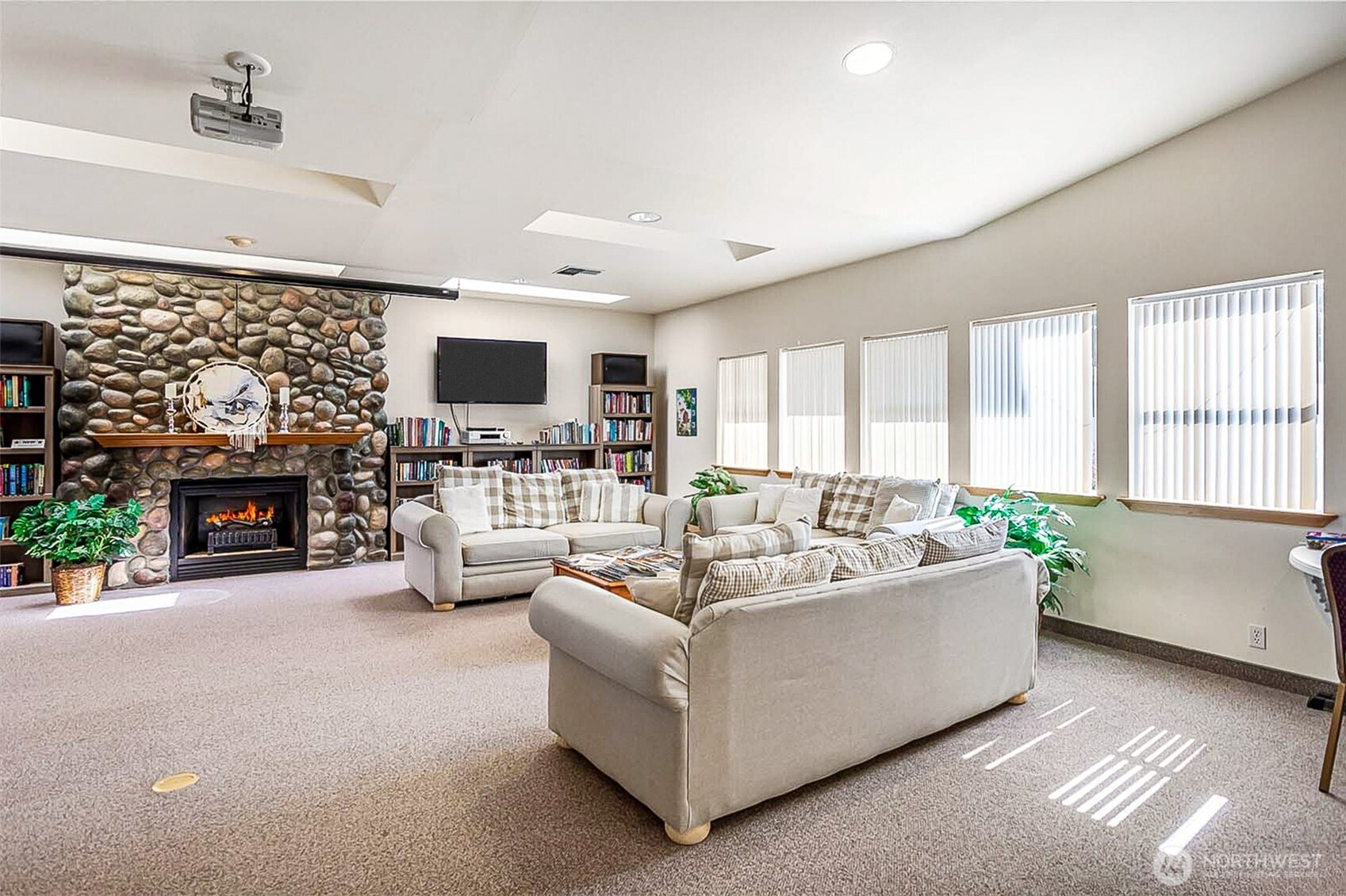 1232 Woods Street Wenatchee, WA 98801 - Photo 30 of 31 a living room with furniture a fireplace and a flat screen tv