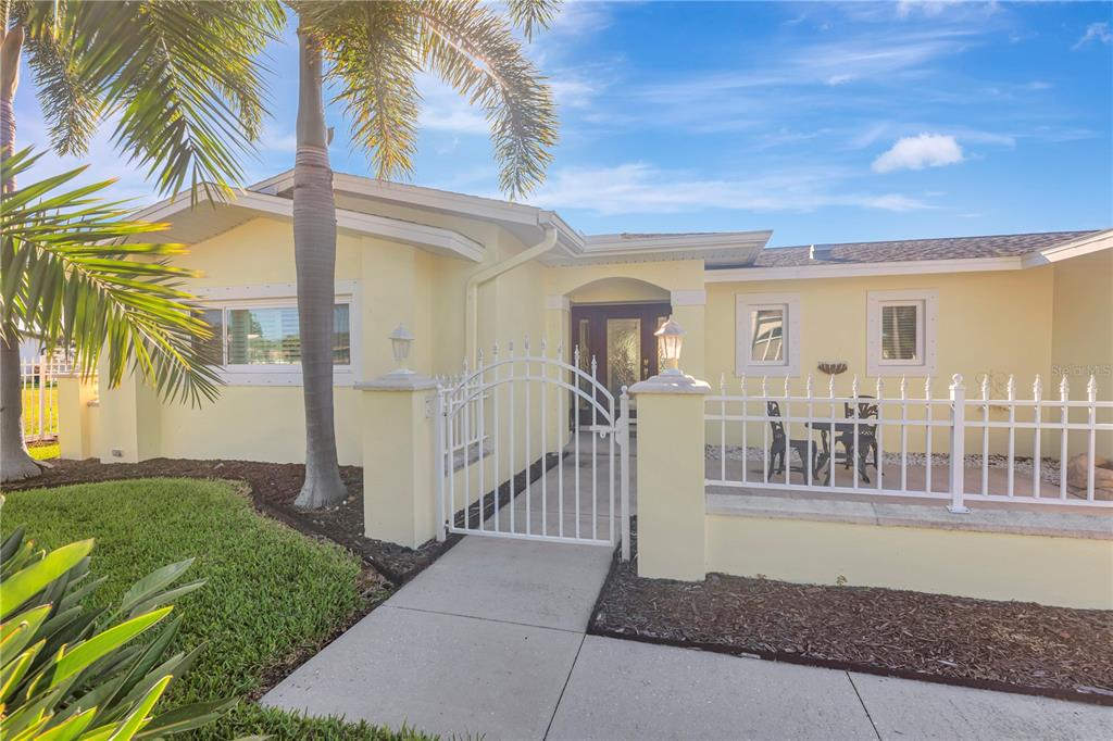 309 Buttonwood Lane Largo, FL 33770 - Photo 1 of 1 a front view of a house with a yard