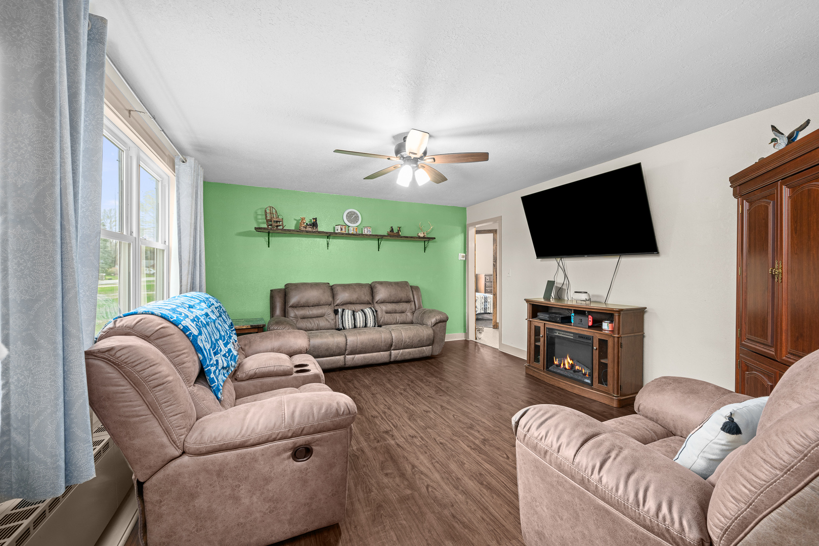 4101 5th Avenue East Moline, IL 61244 - Photo 11 of 36 a living room with furniture and a flat screen tv