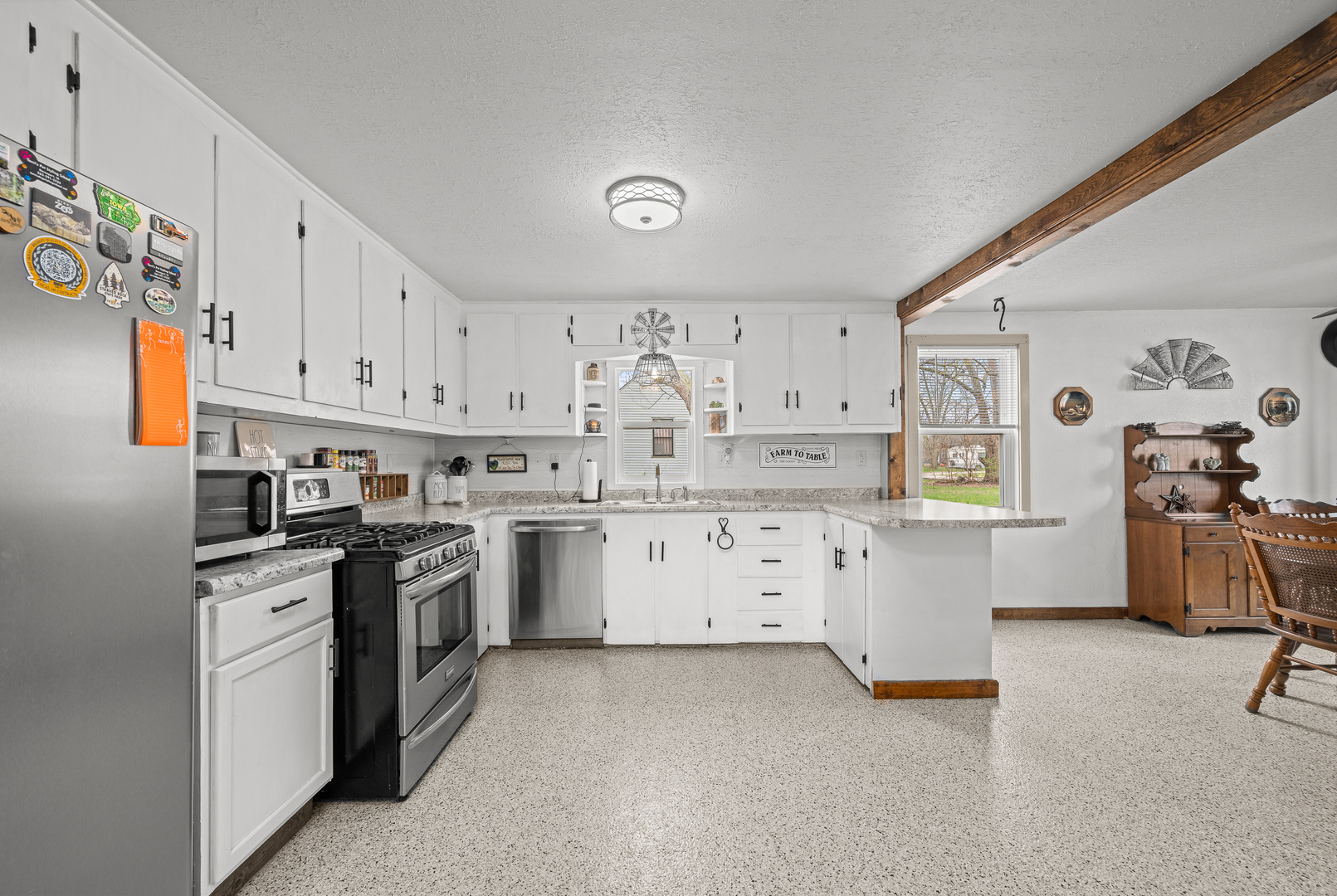 4101 5th Avenue East Moline, IL 61244 - Photo 23 of 36 a kitchen with granite countertop white cabinets and stainless steel appliances